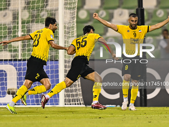 Amin Hazbavi (C) of Asepahan SC celebrates with his teammates after scoring a goal during the AFC Champions League Two Group A football matc...