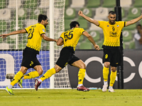 Amin Hazbavi (C) of Asepahan SC celebrates with his teammates after scoring a goal during the AFC Champions League Two Group A football matc...