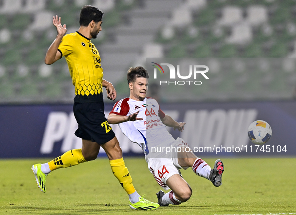 Mehdi Mohebi of Asepahan SC battles for the ball with David Petrovic of Sharjah FC during the AFC Champions League Two Group A football matc...