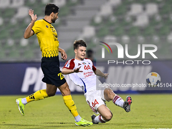 Mehdi Mohebi of Asepahan SC battles for the ball with David Petrovic of Sharjah FC during the AFC Champions League Two Group A football matc...