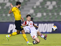 Mehdi Mohebi of Asepahan SC battles for the ball with David Petrovic of Sharjah FC during the AFC Champions League Two Group A football matc...