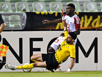 Hossein Goodarzi (bottom) of Sepahan SC battles for the ball with Tyrone Conraad of Sharjah FC during the AFC Champions League Two Group A f...