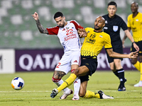 Steven Nzonzi (R) of Sepahan SC battles for the ball with Marcus Vinicius of Sharjah FC during the AFC Champions League Group A football mat...