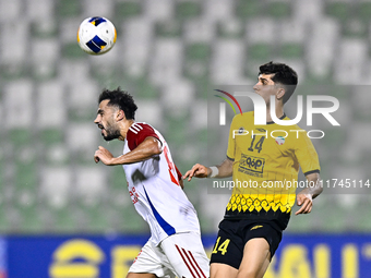 Arya Yousefi of Sepahan SC battles for the ball with Majed Hassan Alahmadi of Sharjah FC during the AFC Champions League Group A football ma...