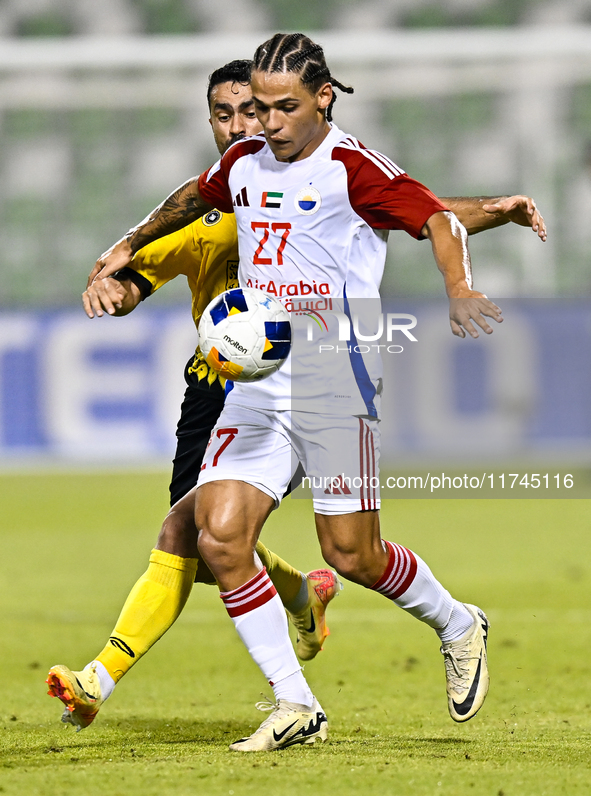 Seyed Mohammad Karimi of Asepahan SC battles for the ball with Guilherme Cunha of Sharjah FC during the AFC Champions League Two Group A foo...