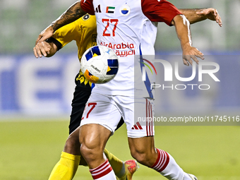 Seyed Mohammad Karimi of Asepahan SC battles for the ball with Guilherme Cunha of Sharjah FC during the AFC Champions League Two Group A foo...