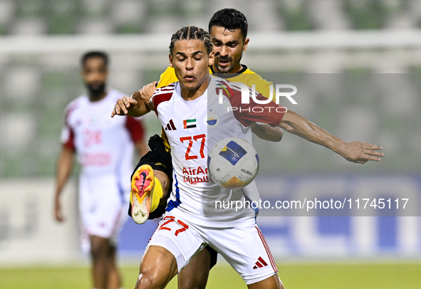 Seyed Mohammad Karimi of Asepahan SC battles for the ball with Guilherme Cunha of Sharjah FC during the AFC Champions League Two Group A foo...