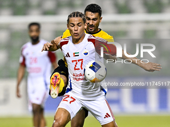 Seyed Mohammad Karimi of Asepahan SC battles for the ball with Guilherme Cunha of Sharjah FC during the AFC Champions League Two Group A foo...