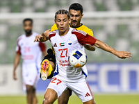 Seyed Mohammad Karimi of Asepahan SC battles for the ball with Guilherme Cunha of Sharjah FC during the AFC Champions League Two Group A foo...