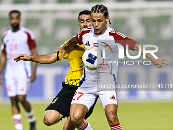 Seyed Mohammad Karimi of Asepahan SC battles for the ball with Guilherme Cunha of Sharjah FC during the AFC Champions League Two Group A foo...