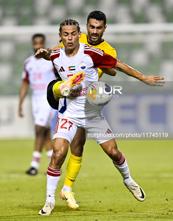 Seyed Mohammad Karimi of Asepahan SC battles for the ball with Guilherme Cunha of Sharjah FC during the AFC Champions League Two Group A foo...