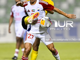 Seyed Mohammad Karimi of Asepahan SC battles for the ball with Guilherme Cunha of Sharjah FC during the AFC Champions League Two Group A foo...