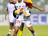 Seyed Mohammad Karimi of Asepahan SC battles for the ball with Guilherme Cunha of Sharjah FC during the AFC Champions League Two Group A foo...