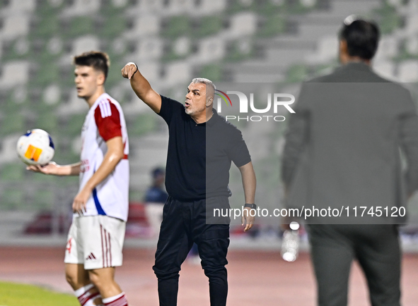 Sharjah FC head coach Aurelian Olaroiu reacts during the AFC Champions League Group A football match between United Arab Emirates' Sharjah F...