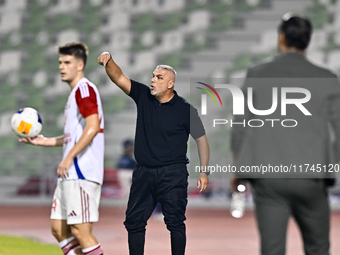 Sharjah FC head coach Aurelian Olaroiu reacts during the AFC Champions League Group A football match between United Arab Emirates' Sharjah F...