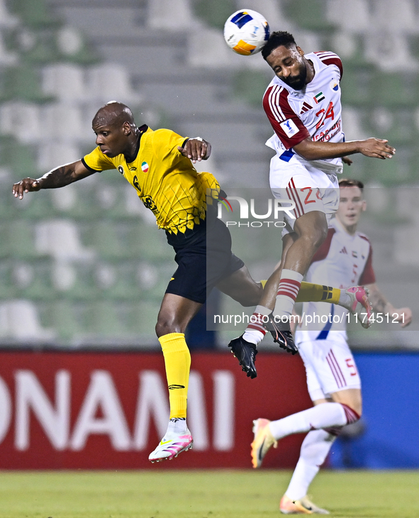 Bryan Dabo of Sepahan SC battles for the ball with Majid Rashid Almehrzi of Sharjah FC during the AFC Champions League Group A football matc...