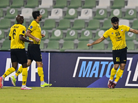 Amin Hazbavi of Asepahan SC celebrates with his teammates after scoring a goal during the AFC Champions League Two Group A football match be...