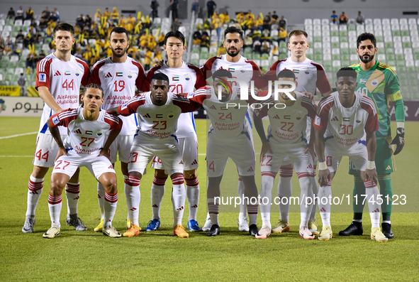 Sharjah FC team players pose for a team photo before the AFC Champions League Two Group A football match between United Arab Emirates' Sharj...