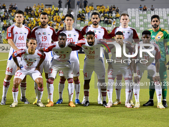 Sharjah FC team players pose for a team photo before the AFC Champions League Two Group A football match between United Arab Emirates' Sharj...