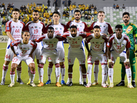 Sharjah FC team players pose for a team photo before the AFC Champions League Two Group A football match between United Arab Emirates' Sharj...