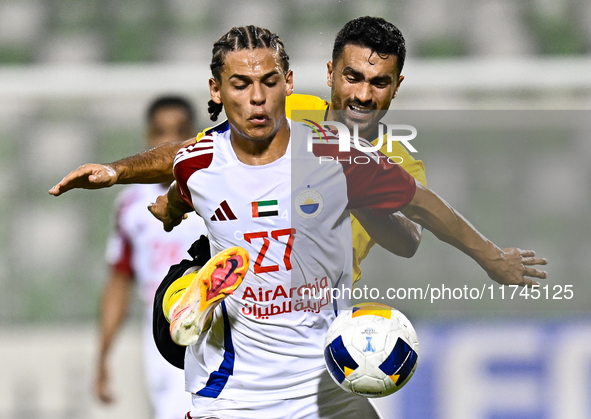 Seyed Mohammad Karimi of Asepahan SC battles for the ball with Guilherme Cunha of Sharjah FC during the AFC Champions League Two Group A foo...