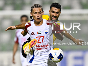 Seyed Mohammad Karimi of Asepahan SC battles for the ball with Guilherme Cunha of Sharjah FC during the AFC Champions League Two Group A foo...