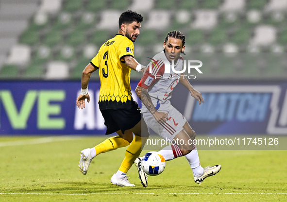 Hossein Goodarzi of Sepahan SC battles for the ball with Guilherme Cunha of Sharjah FC during the AFC Champions League Group A football matc...