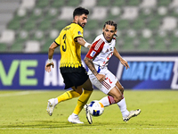 Hossein Goodarzi of Sepahan SC battles for the ball with Guilherme Cunha of Sharjah FC during the AFC Champions League Group A football matc...