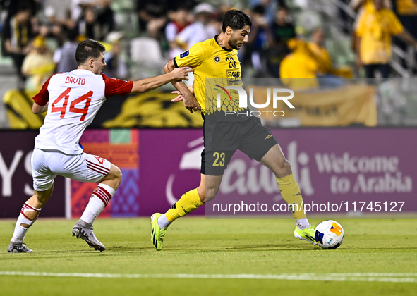 Mehdi Mohebi of Sepahan SC battles for the ball with David Petrovic of Sharjah FC during the AFC Champions League Group A football match bet...