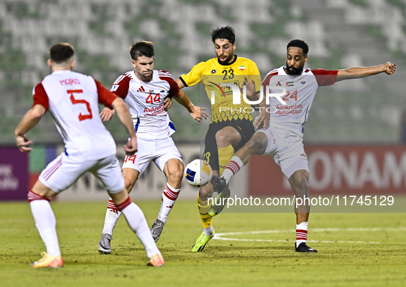 Mehdi Mohebi of Sepahan SC competes for the ball with Majid Rashid Almehrzi of Sharjah FC during the AFC Champions League Group A football m...