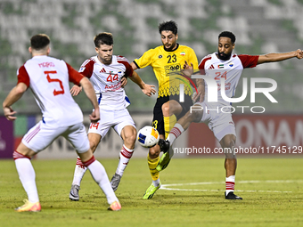 Mehdi Mohebi of Sepahan SC competes for the ball with Majid Rashid Almehrzi of Sharjah FC during the AFC Champions League Group A football m...