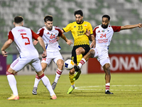 Mehdi Mohebi of Sepahan SC competes for the ball with Majid Rashid Almehrzi of Sharjah FC during the AFC Champions League Group A football m...