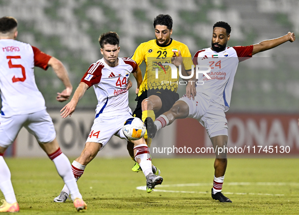 Mehdi Mohebi of Sepahan SC competes for the ball with Majid Rashid Almehrzi of Sharjah FC during the AFC Champions League Group A football m...