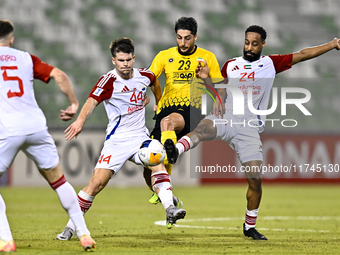 Mehdi Mohebi of Sepahan SC competes for the ball with Majid Rashid Almehrzi of Sharjah FC during the AFC Champions League Group A football m...