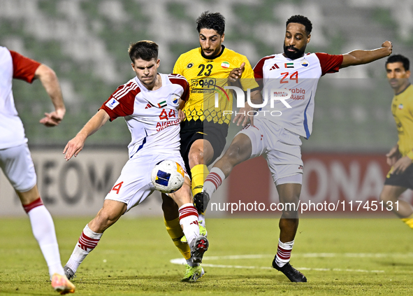 Mehdi Mohebi of Sepahan SC competes for the ball with Majid Rashid Almehrzi of Sharjah FC during the AFC Champions League Group A football m...