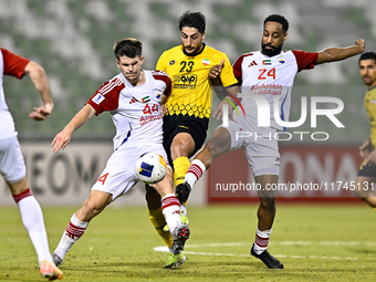 Mehdi Mohebi of Sepahan SC competes for the ball with Majid Rashid Almehrzi of Sharjah FC during the AFC Champions League Group A football m...