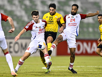 Mehdi Mohebi of Sepahan SC competes for the ball with Majid Rashid Almehrzi of Sharjah FC during the AFC Champions League Group A football m...