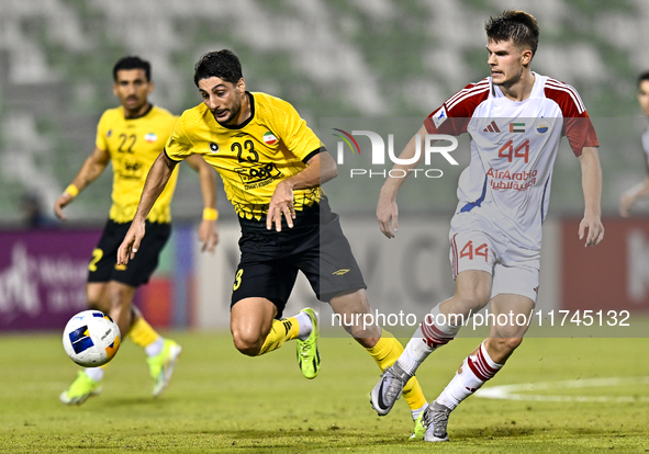 Mehdi Mohebi of Asepahan SC battles for the ball with David Petrovic of Sharjah FC during the AFC Champions League Two Group A football matc...