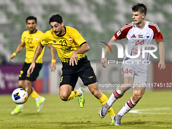 Mehdi Mohebi of Asepahan SC battles for the ball with David Petrovic of Sharjah FC during the AFC Champions League Two Group A football matc...