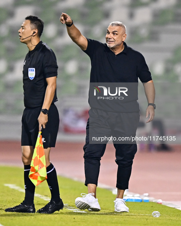 Sharjah FC head coach Aurelian Olaroiu reacts during the AFC Champions League Group A football match between United Arab Emirates' Sharjah F...