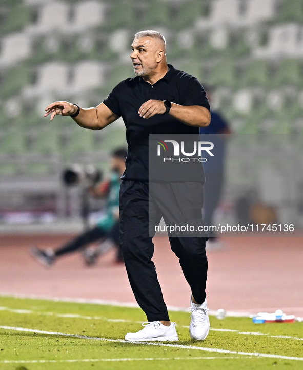 Sharjah FC head coach Aurelian Olaroiu reacts during the AFC Champions League Group A football match between United Arab Emirates' Sharjah F...