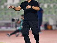 Sharjah FC head coach Aurelian Olaroiu reacts during the AFC Champions League Group A football match between United Arab Emirates' Sharjah F...