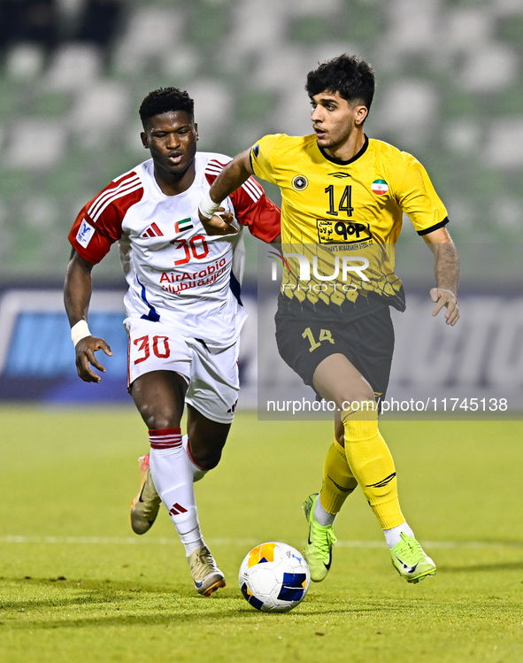 Arya Yousefi of Asepahan SC battles for the ball with Ousmane Camar of Sharjah FC during the AFC Champions League Two Group A football match...