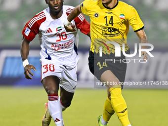 Arya Yousefi of Asepahan SC battles for the ball with Ousmane Camar of Sharjah FC during the AFC Champions League Two Group A football match...