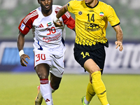 Arya Yousefi of Asepahan SC battles for the ball with Ousmane Camar of Sharjah FC during the AFC Champions League Two Group A football match...