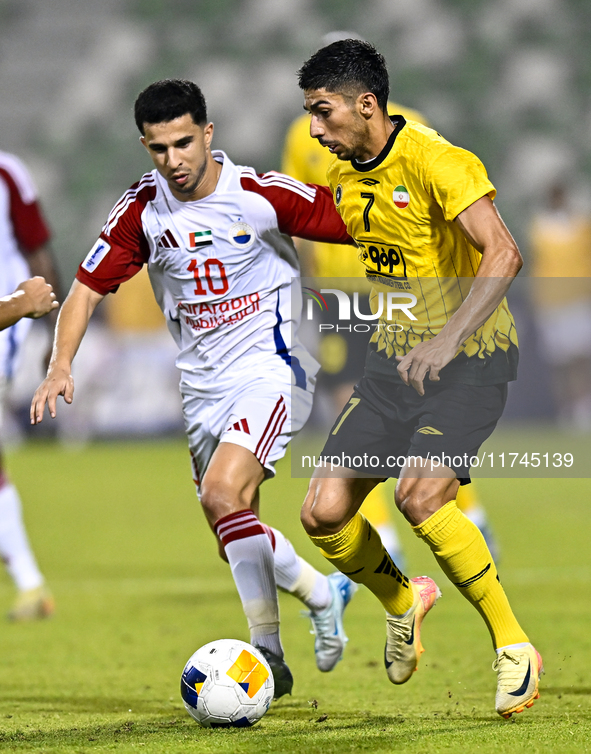 Mehdi Lamouchi of Sepahan SC battles for the ball with Mohamed Firas of Sharjah FC during the AFC Champions League Group A football match be...