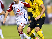 Mehdi Lamouchi of Sepahan SC battles for the ball with Mohamed Firas of Sharjah FC during the AFC Champions League Group A football match be...