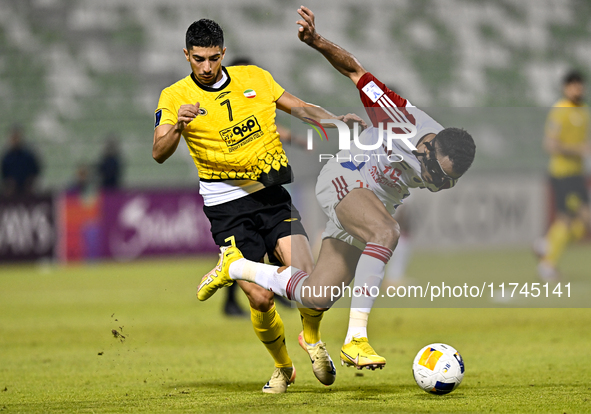 Mehdi Lamouchi of Sepahan SC battles for the ball with Khaled Ebraheim Aldhanhani of Sharjah FC during the AFC Champions League Group A foot...