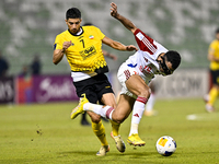 Mehdi Lamouchi of Sepahan SC battles for the ball with Khaled Ebraheim Aldhanhani of Sharjah FC during the AFC Champions League Group A foot...