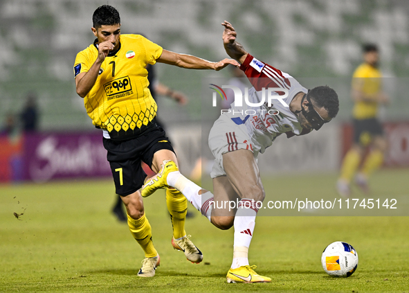 Mehdi Lamouchi of Sepahan SC battles for the ball with Khaled Ebraheim Aldhanhani of Sharjah FC during the AFC Champions League Group A foot...